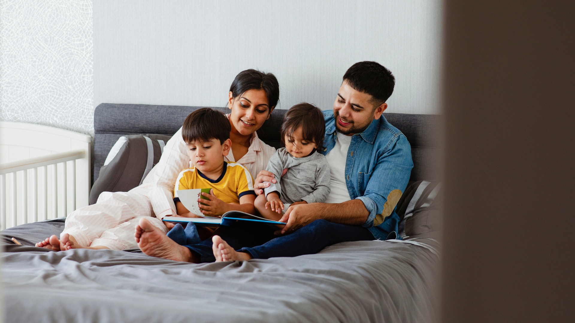 A family reading together via Canva.